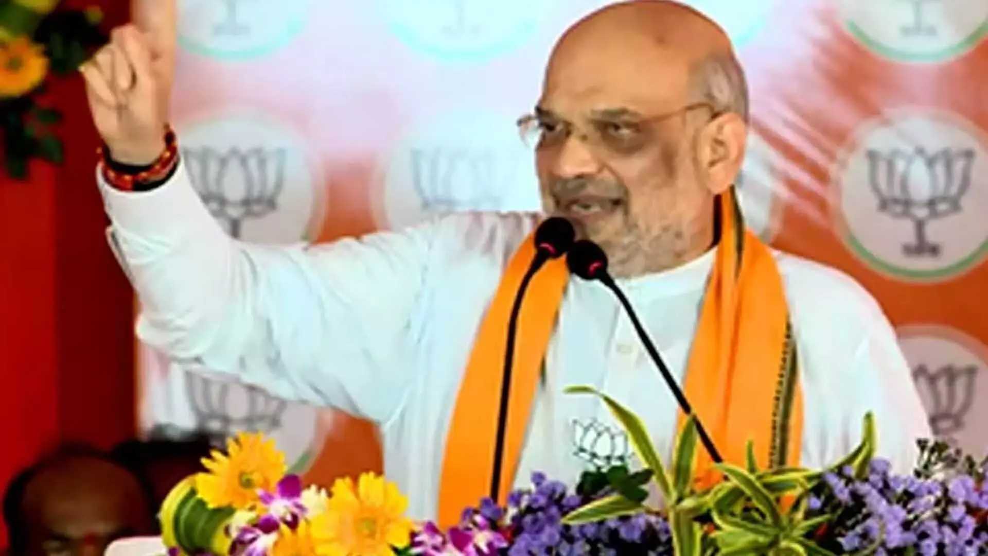 अमित शाह ने नवीन पटनायक सरकार पर निशाना साधते हुए कहा, चावल वाली सरकार बनाम झोले वाली सरकार अमित शाह ने नवीन पटनायक सरकार पर निशाना साधते हुए कहा, चावल वाली सरकार बनाम झोले वाली सरकार